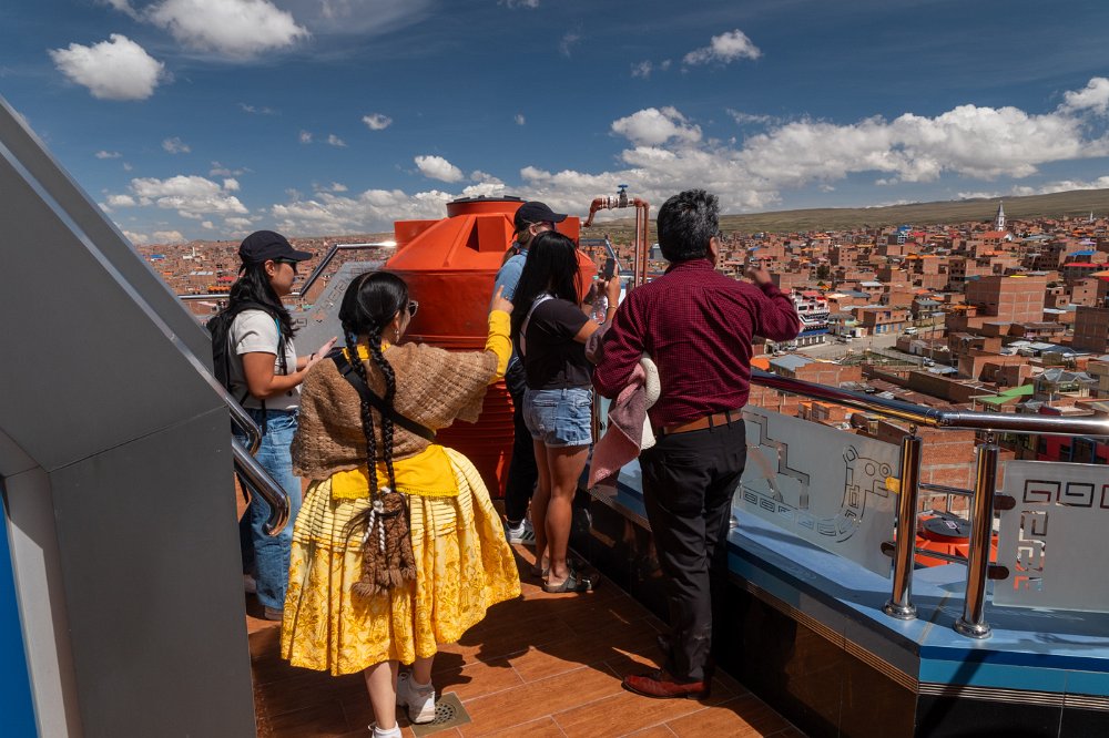 Aracely guiding guests at a viewpoint above La Paz.